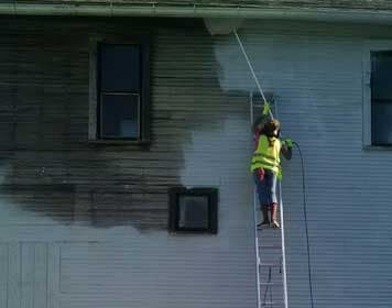 Power washing and prep on a commercial building exterior