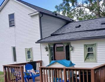 Exterior painting progress on a cozy home