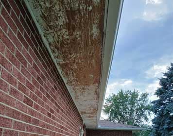 Residential soffit painting before and after